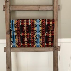 Large envelope clutch with Aztec design.